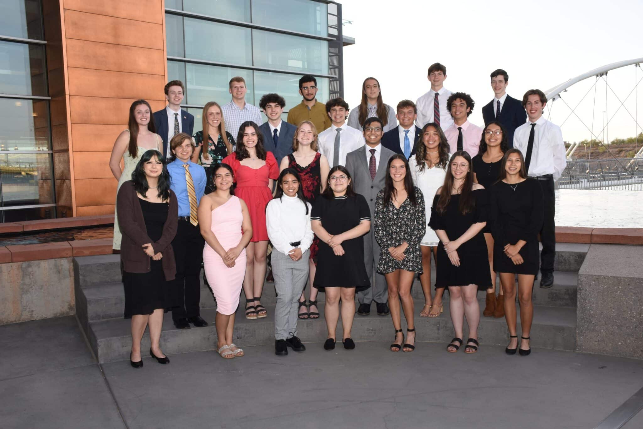 Tempe Diablos scholarship recipients posing for a group photo outdoors